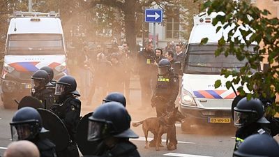 Police clash with far-right protesters at anti-immigration rally in The Hague