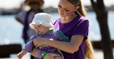 Photos: Put Your Foot Down walk brings a sea of purple to foreshore