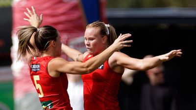 Suns surge to victory, Tigers survive Giant AFLW scare