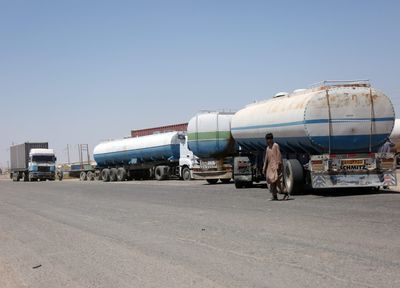Iran's economy faces another blockade: Red tape and gridlock are clogging up land routes that bypass the U.S. Navy's Hormuz stranglehold