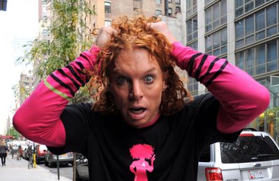 Carrot Top 'awake' and 'breathing on his own'