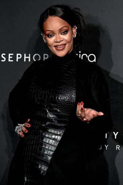 Rihanna Wears a Stunning Midnight-Blue Tom Ford Suit to Céline Dion's Paris Concert