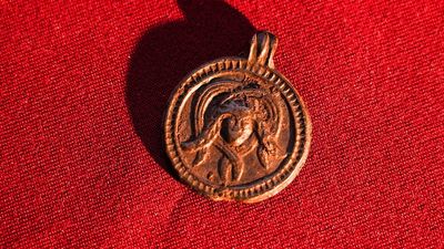 Archaeologists found an pendant in Russia showing a Christian saint and a Medusa-like figure