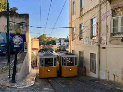 In 1885, Lisbon built a cable railway up one of its steepest streets; the Glória line later became a national monument and carried about 3 million passengers annually