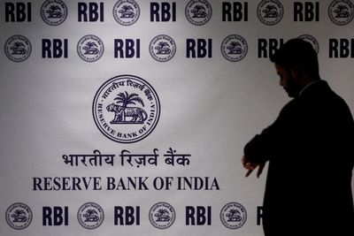 RBI bond sales, FX intervention help halve India's cash overhang