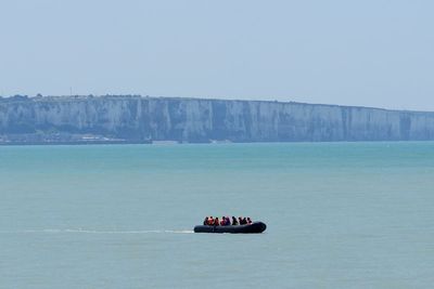 UK rescue boats sent to collect migrant dinghy which has spent 30 hours at sea
