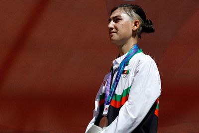 Cyclist who escaped Taliban wins silver in Asian Games road race