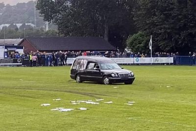 Five men charged after hearse driven onto football pitch forcing match to be abandoned