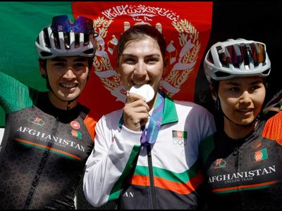 Afghan cyclist Fariba Hashimi who disguised herself as man wins Asian Games silver