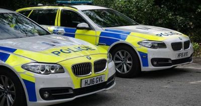 Police swarm Scottish street after car flips onto roof in dramatic crash