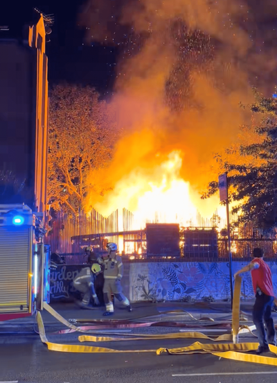 Watch: Fire tears through community garden in east London