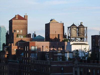 New York requires rooftop tanks on buildings over six storeys, and 5,600 are wooden; three family firms still build them from staves with no nails or sealant