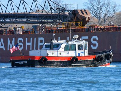 Since 1874, a boat on the Detroit River has passed mail to freighters that never stop, hauled up in a bucket on a rope; it has its own ZIP code: 48222