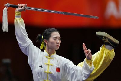 Photos of wushu athletes performing martial arts routines at the Asian Games