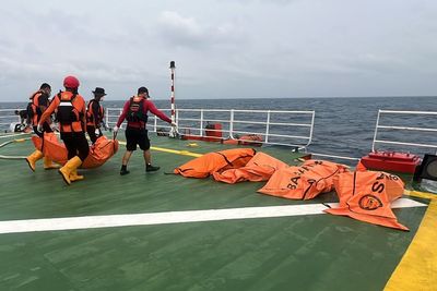 Indonesian divers recover 52 bodies from capsized ferry as 83 people remain missing