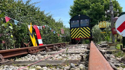Retired UK rail engineer turns East Sussex garden into 50-foot railway with solar-powered trolley