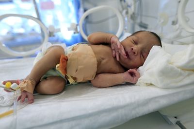 Kagan's One-Line Denial Leaves Genetic Parents in Charge of Newborn's Heart Care as Surrogate's Emergency Bid Fails