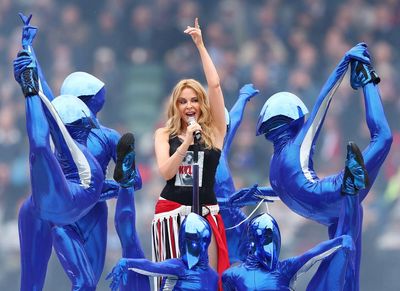 Kylie Minogue brings the party to AFL grand final with 20 minutes of dizzying, sparkling joy