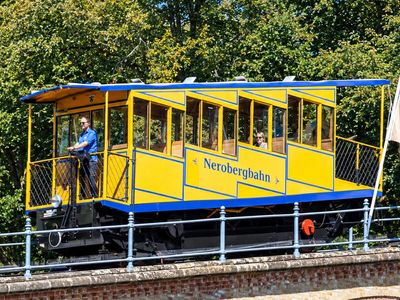 In 1888, a German city built a railway that climbs without an onboard engine: 1,849 gallons of water weigh one car down enough to pull the other 272 feet uphill