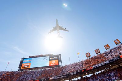 College football fans enjoy low-altitude Air Force One flyover as Trump attends game