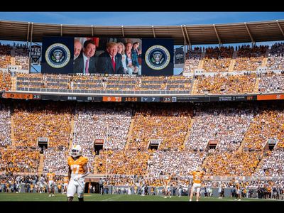 Donald Trump's Air Force One does low-altitude flyover during Tennessee vs Texas college football game. Video goes viral, watch here