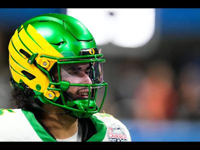 Watch: Oregon QB Dante Moore’s head smashes hard onto turf after a late hit, carted off the field in a viral video; check injury update