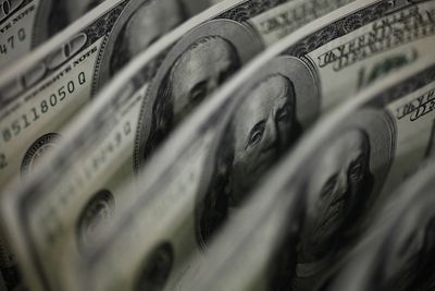 Dollar hold near two-month peak as yields rise, Fed data looms