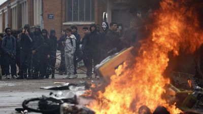 French police clash with teens blockading schools as unions stage day of protests