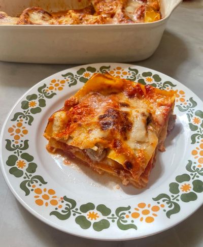 Rachel Roddy’s recipe for lasagne with three cheeses, tomato and tiny meatballs