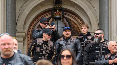 Riders rally over potholes as land tax cut locked in