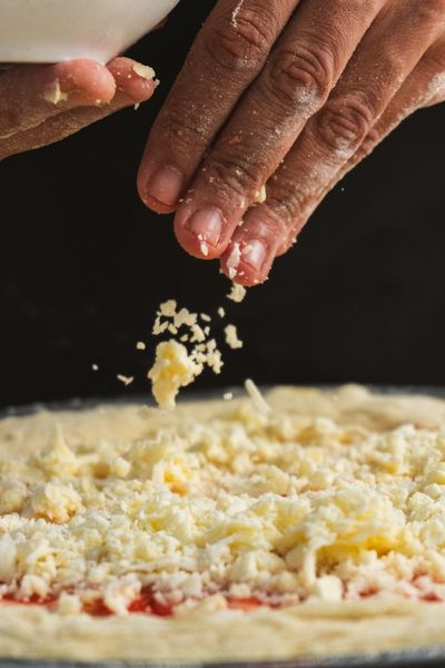 Why Does Shredded Cheese Have White Powder All Over It?