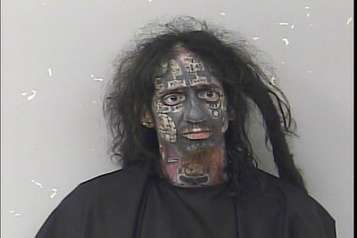 Bizarre mugshot shows ‘demonologist’ accused of tracking women by their phones