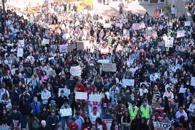 Hundreds join protest at Cornell University to call for frat members to be expelled after rape allegations