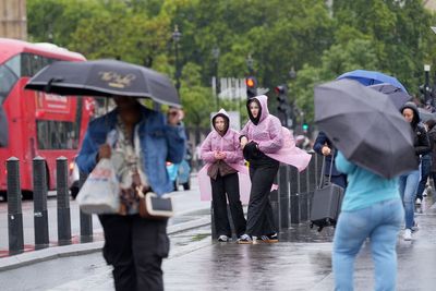 London weather: Commuters hit by sudden 10C temperature drop today as rain drenches capital