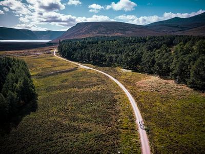 ‘It’s hard to imagine the fires of July’: a bike ride through the Cairngorms in Scotland