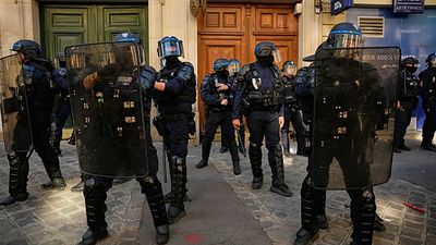 France suspends police stun grenades at student protests after teenager loses hand