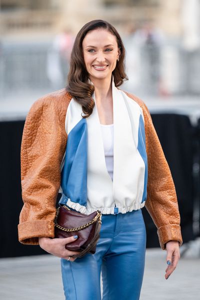 Sophie Turner Debuts Darker Hair and Retro Leather Look at Louis Vuitton