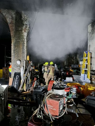 Firefighters battle gas cylinder blaze under London railway arches