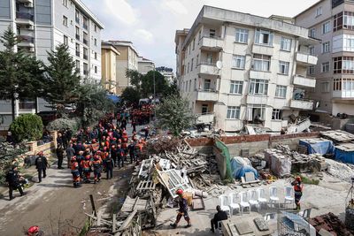 A partial building collapse in Istanbul kills 1 and traps at least 3 people