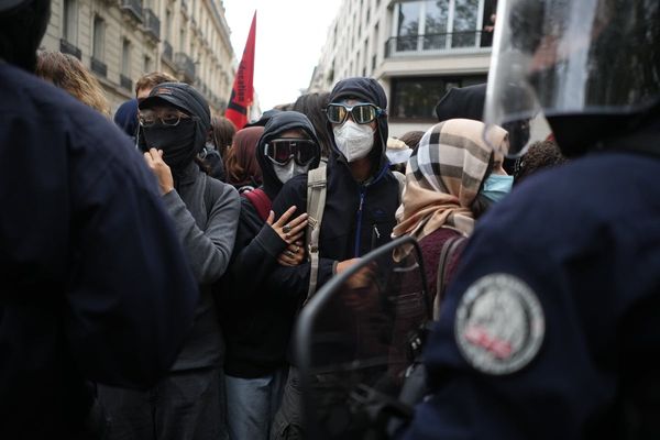 Police fire tear gas at a barricaded high school in Paris as school protests show no sign of ending