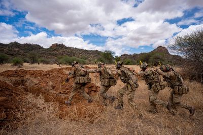 British soldier regiment 'Lions of England' stalked by pack of hyenas in Kenya
