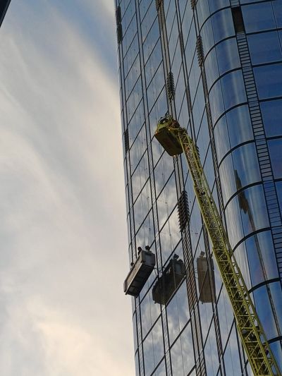 London skyscraper drama as window cleaners rescued from 15th floor