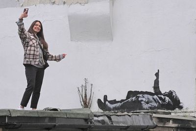 Two concrete walls with new Banksy artwork to be craned into garden for exhibition