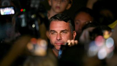 Brazil's Flavio Bolsonaro wins support of third-place candidate in presidential race