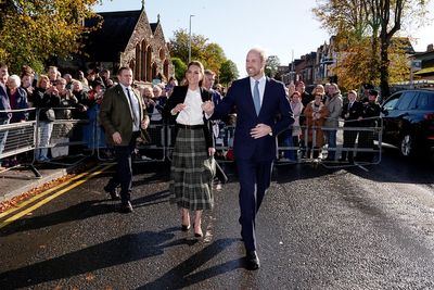 William and Kate dodge rain showers to meet community centre supporters