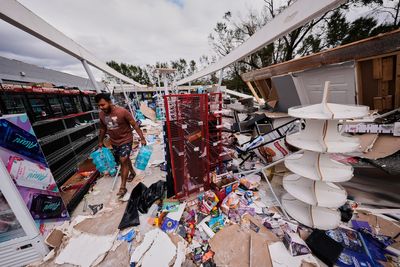 Isaias leaves trail of damage as it moves inland, in photos