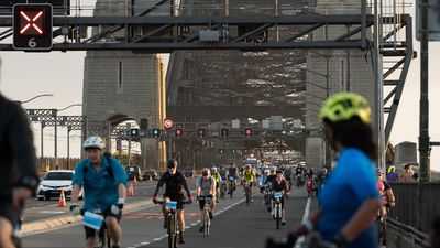 Cyclists shut down iconic bridge for mental health ride