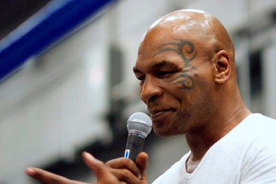 Mike Tyson Appears To Shut Down Natalie Harp With 'I'm Busy on the Phone,' Lip Reader Claims