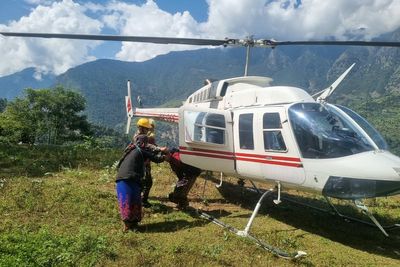 Rescue helicopters race to flood-hit Nepal villages as 5 reported missing
