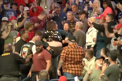 Woman Wearing 'Release Epstein Files' Shirt Punched at Trump Rally as President Calls Her 'Scum' and Crowd Chants 'USA'